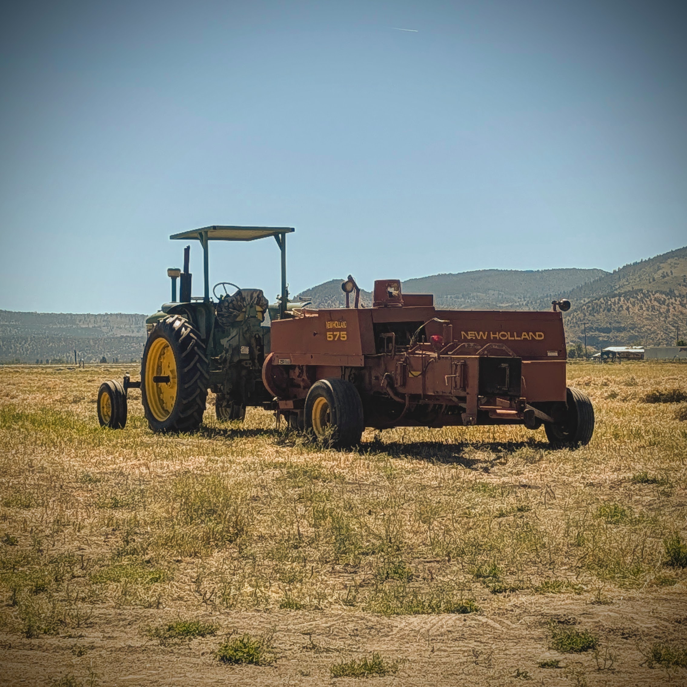New Holland 575 baler making two-string small square bales at Sunset Basin Farms
