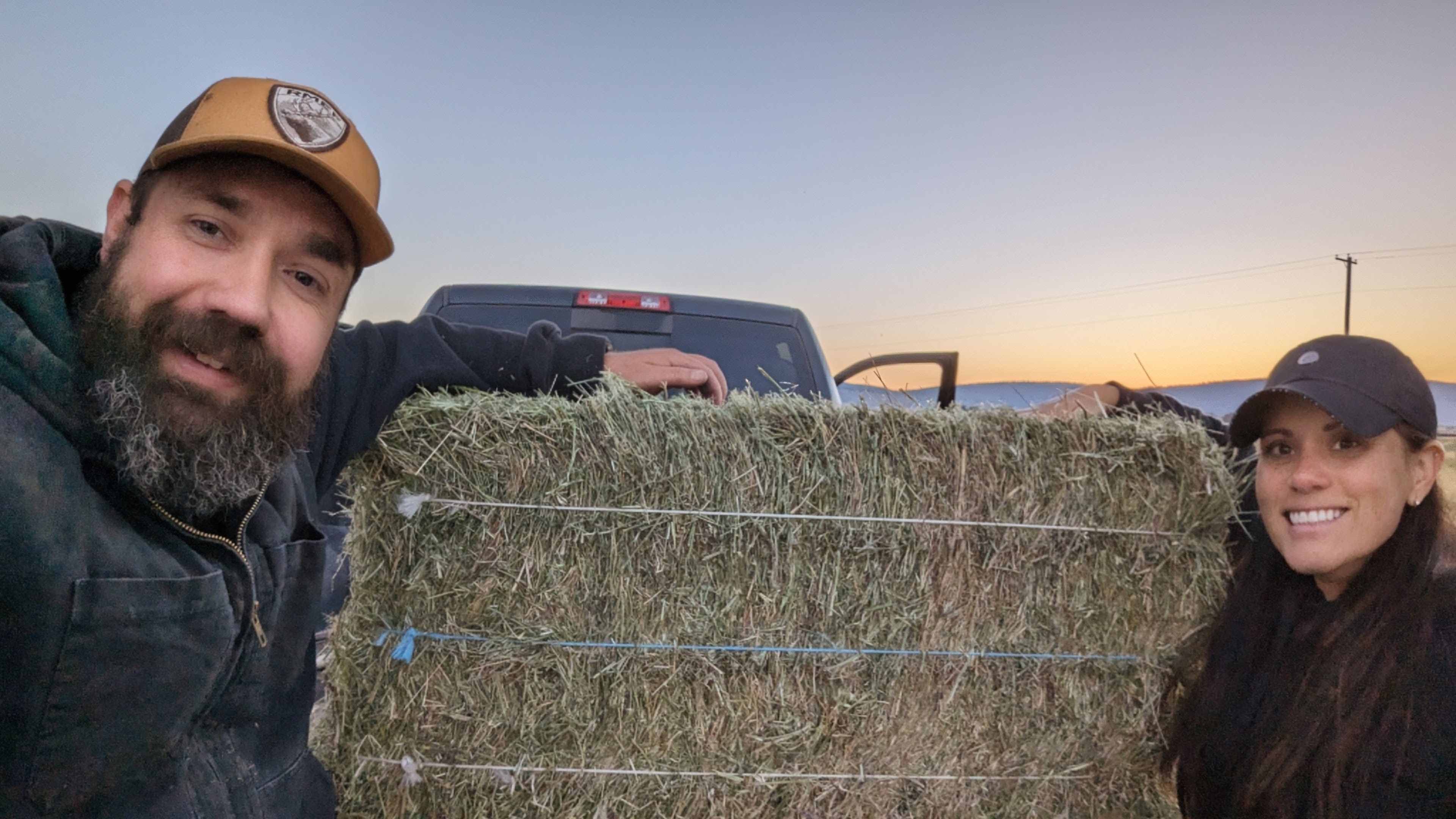 Chris and Sara with a finished hay bale
