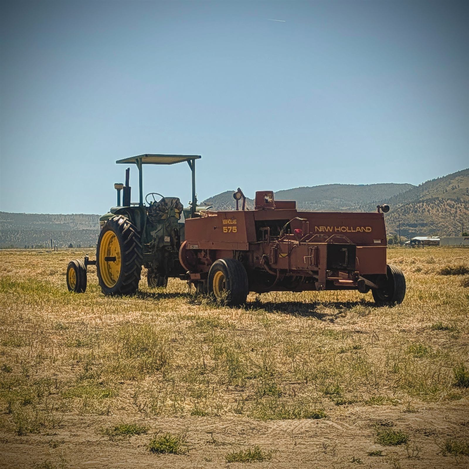 New Holland 575 baler making two-string small square bales at Sunset Basin Farms