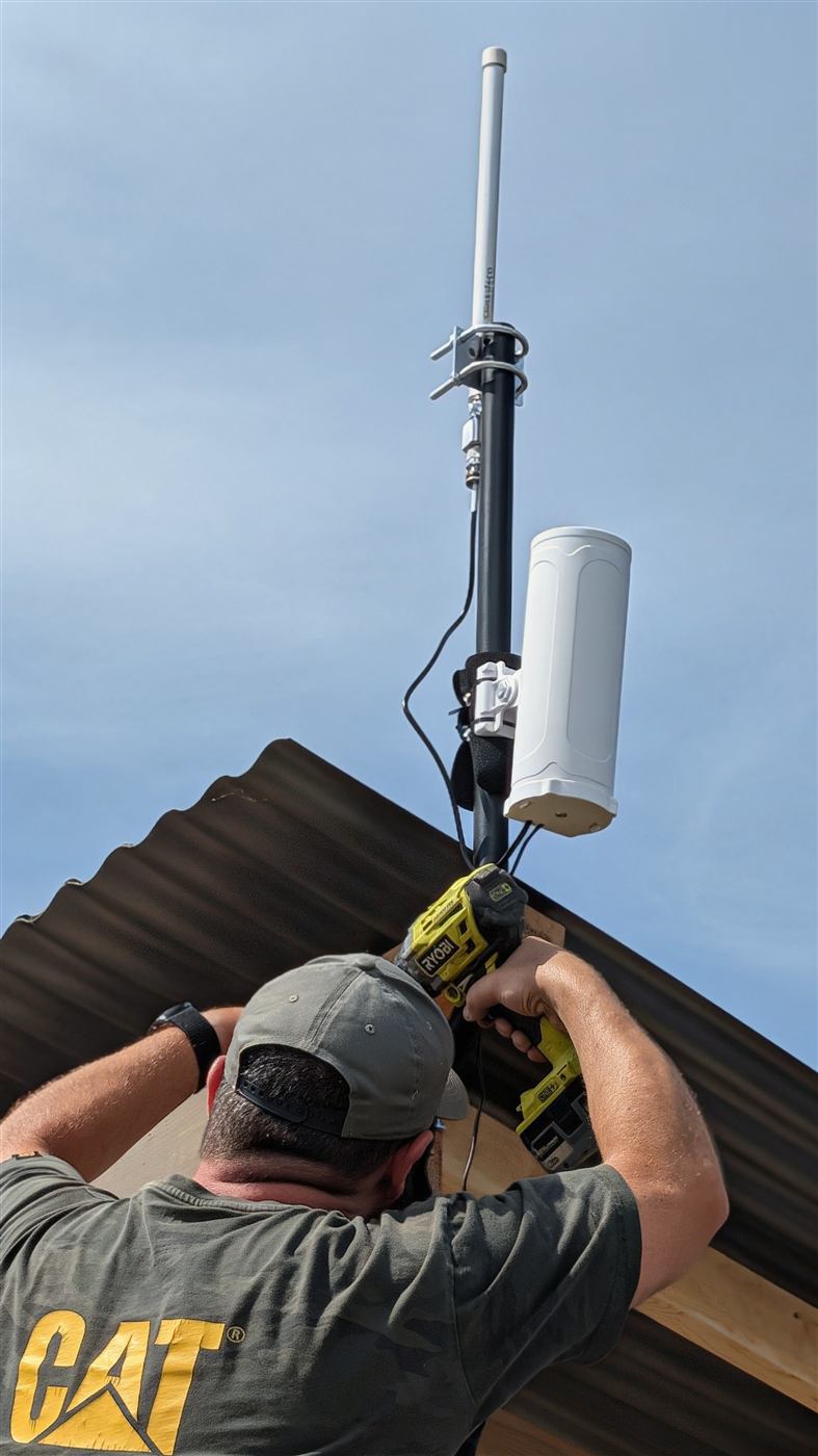 Installing a Basin Roots LoRaWAN gateway at Sunset Basin Farms.